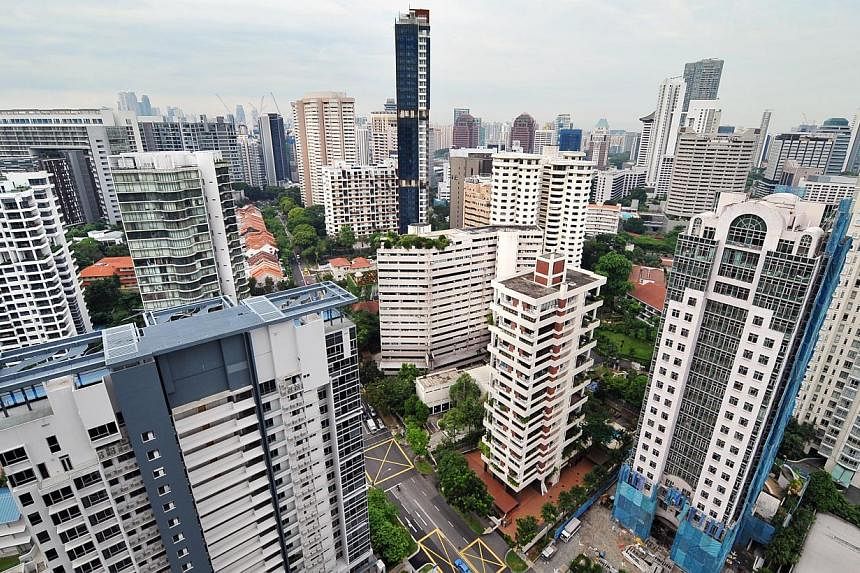 The anaemic property market continued to bear the brunt of cooling measures as private property home prices fell for a fourth straight quarter.&nbsp;-- ST PHOTO: ALPHONSUS CHERN