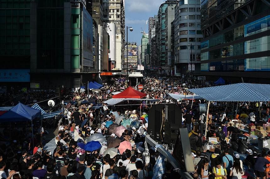 Pro-democracy protestors gather in the Mong Kok district of Kowloon in Hong Kong on Oct 1, 2014. -- PHOTO: AFP