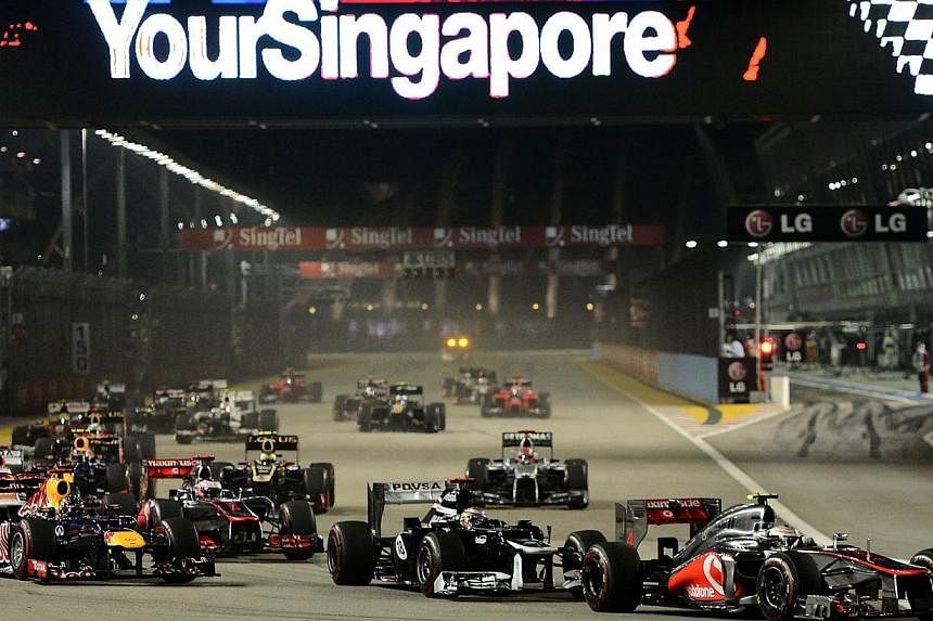 The sale of early bird tickets for next year's Singapore Airlines Singapore Grand Prix will start at 9am on Friday and Formula One fans can enjoy discounts of up to 25 per cent off regular ticket prices. -- ST PHOTO:&nbsp;MUGILAN RAJASEGERAN