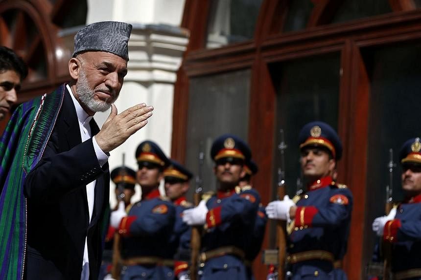 Former Afghanistan president Hamid Karzai arrives for the inauguration of the new president in Kabul on Sept 29, 2014.Mr Karzai may have brought development and relative stability to major cities, but an insurgency-wracked countryside and sky-high co