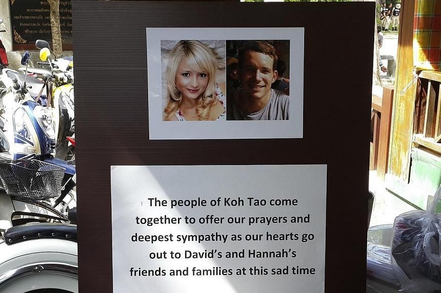 Pictures of killed British tourists David Miller and Hannah Witheridge and a message of support to their friends and families are displayed during special prayers at Koh Tao island on Sept 18, 2014.&nbsp;A Myanmar man has confessed to the murder of t