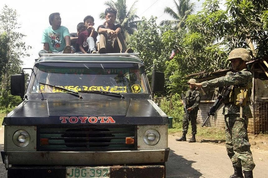 Soldiers stopping a vehicle at a military checkpoint in Jolo, Sulu, in southern Philippines on Sept 25, 2014.&nbsp;Extremist groups in the restive southern island of Mindanao are seen "mutating" into a "large, more coordinated, more sophisticated org