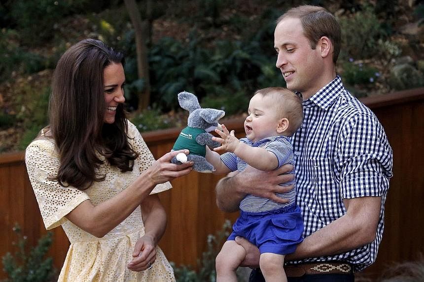 A file picture taken on April 20, 2014, shows Britain's Prince William, (right) his wife Catherine, the Duchess of Cambridge (left) and their son Prince George during a visit to Sydney's Taronga Zoo. -- PHOTO: REUTERS