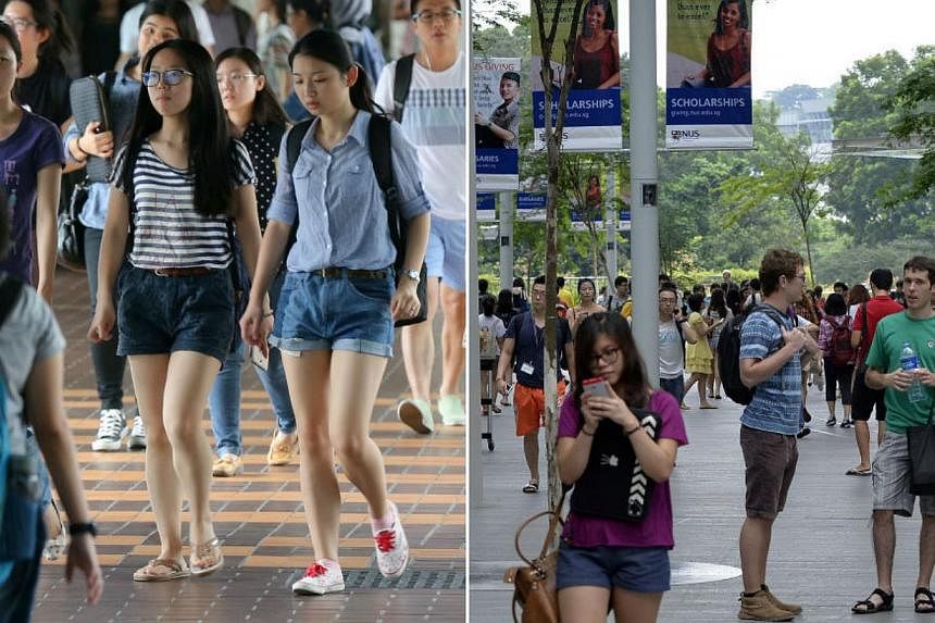 Students from NTU (left) and NUS on campus. -- PHOTO: ST FILE
