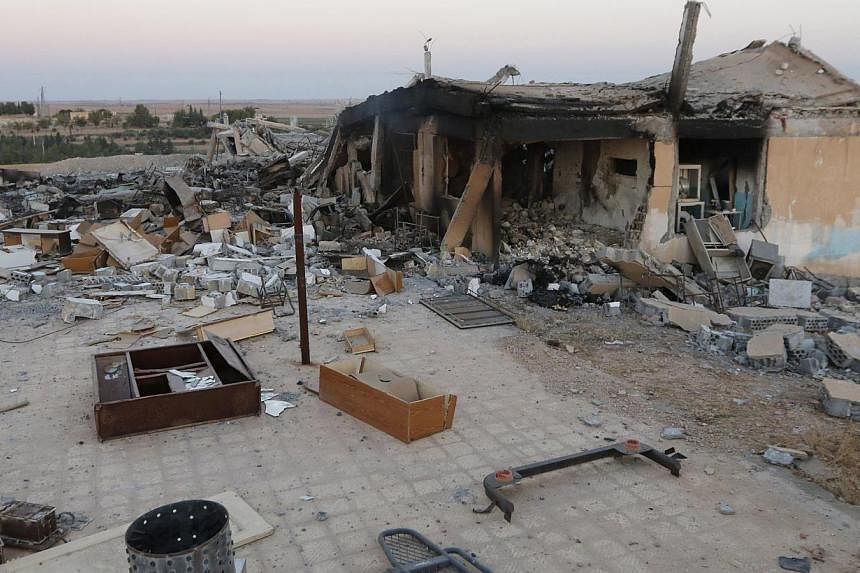 A general view shows a damaged school that was targeted on Monday by what activists said were US-led air strikes, at Ain al-Arous town in Raqqa governorate on Oct 1, 2014. -- PHOTO: REUTERS