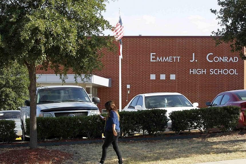 A student walks past Emmet J. Conrad High School in Dallas, Texas on Oct 1, 2014, where a fellow student came into contact with a man diagnosed with the Ebola virus.&nbsp;US health officials scoured the Dallas area on Wednesday for people - including
