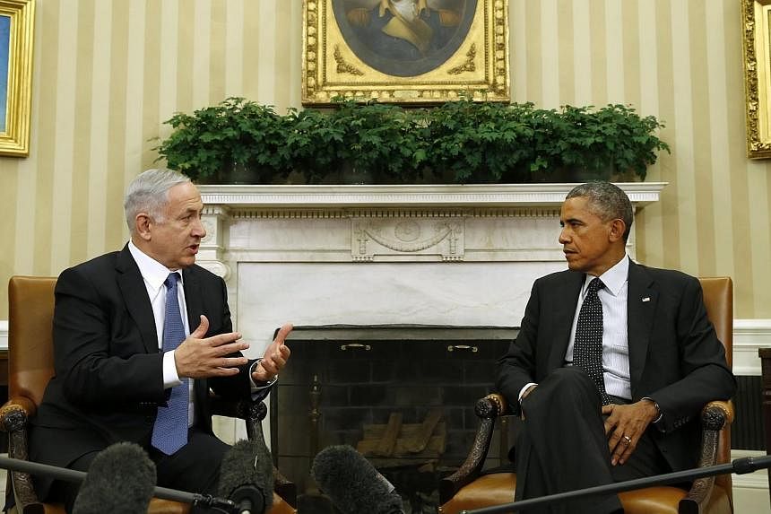 US President Barack Obama (right) meets with Israel's Prime Minister Benjamin Netanyahu at the White House in Washington on Oct 1, 2014. -- PHOTO: REUTERS