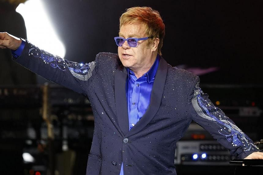 British pop music icon Elton John (above) and his partner David Furnish will be the guests of honour when the Human Rights Campaign hosts its annual gala, the LGBT rights group said Wednesday. -- PHOTO: AFP