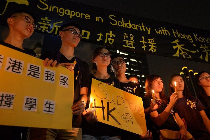 A group of supporters pose for a group photo during after a candlelight vigil at Hong Lim Park on Oct 1, 2014.&nbsp;-- ST PHOTO:&nbsp;CAROLINE CHIA