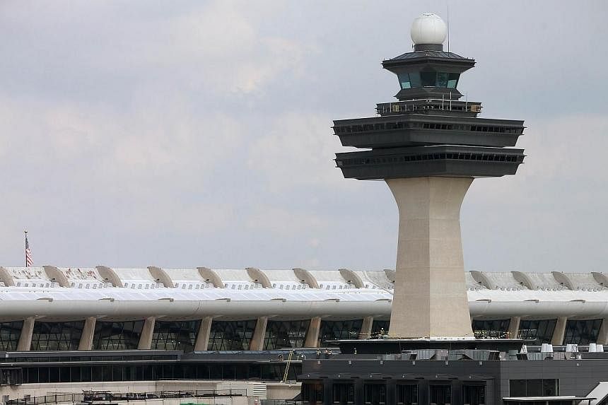 The main terminal at Washington Dulles International Airport on Oct 2, 2014, in Dulles, Virginia. The first person diagnosed in the United States for Ebola flew to Texas via Brussels and Washington. -- PHOTO: AFP&nbsp;