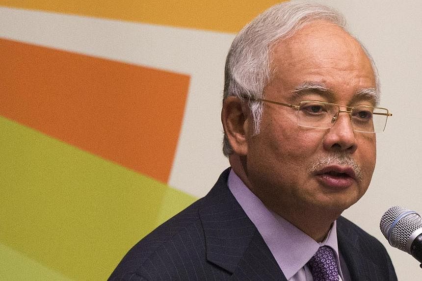 Malaysia will unveil a 2015 budget next Friday that investors hope will reduce a fuel subsidy bill that is exacerbating the country's worryingly high debt levels. -- PHOTO: REUTERS