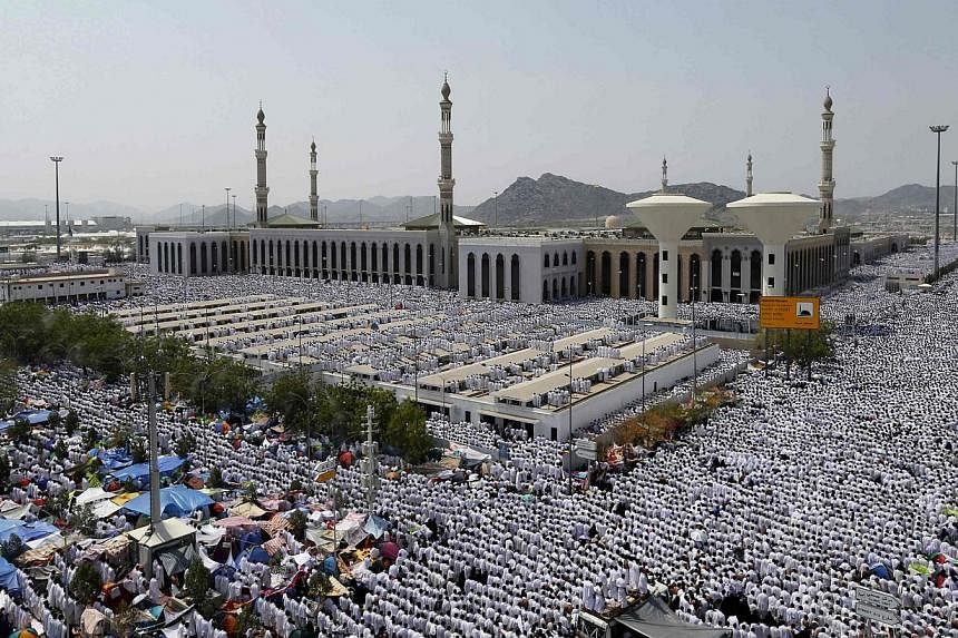 Muslim pilgrims perform Friday prayers around Nimrah mosque on the plains of Arafat during the annual haj pilgrimage, outside the holy city of Mecca on Oct 3, 2014.&nbsp;The enemies of Muslim nations are trying to spread "chaos and confusion", Saudi 