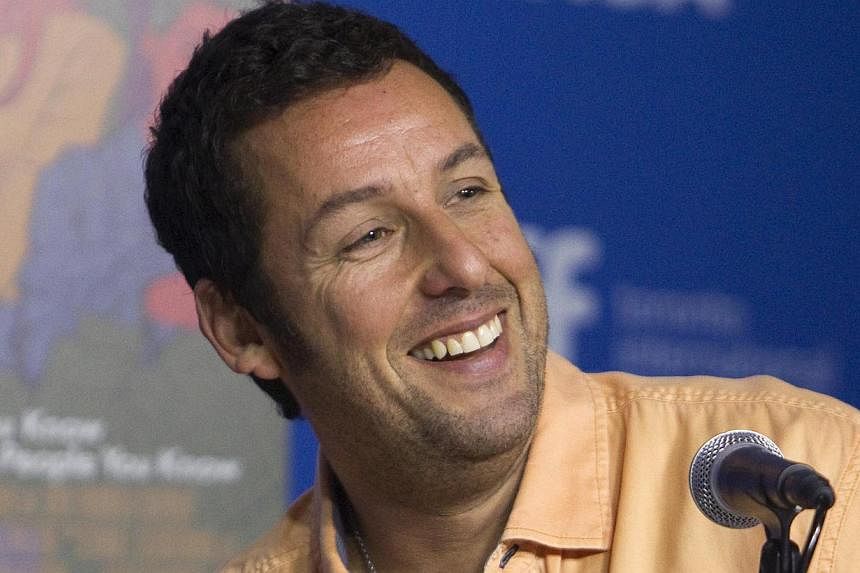 Netflix announced on Thursday it has signed comic actor Adam Sandler to produce four films for the streaming video group, expanding its foray into cinema. -- PHOTO: REUTERS