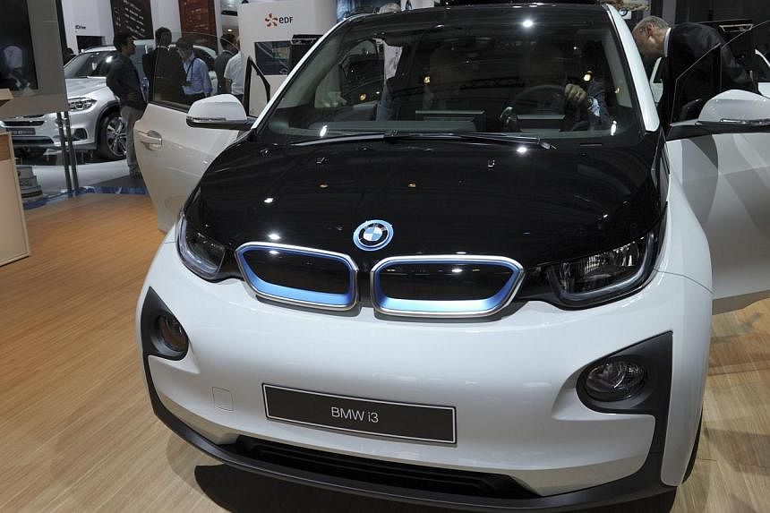 The BMW i3 is unveiled at the Paris Auto Show on Oct 2, 2014, on the first of the two press days. -- PHOTO: AFP