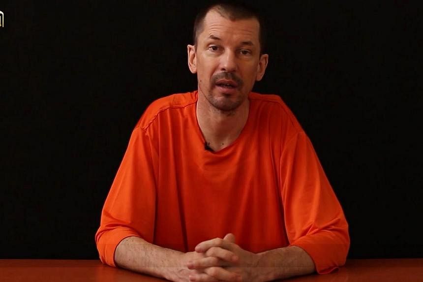 The father of captive British journalist John Cantlie issued a statement on Friday pleading for his son's release and said his family had tried to communicate with the Islamic State (IS) insurgent group holding him. -- PHOTO: AFP