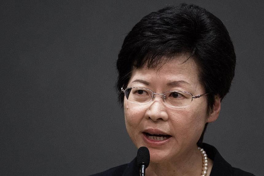 Hong Kong's Chief Secretary Carrie Lam addresses a press conference in Hong Kong on July 15, 2014. -- PHOTO: AFP