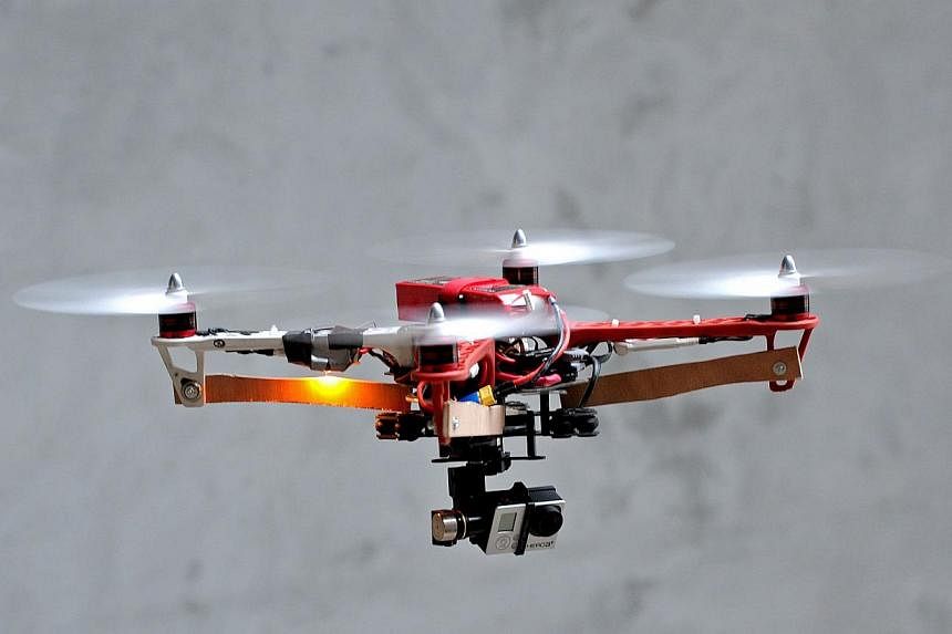 A July 2, 2014 file photo shows a drone prototype equiped with a GoPro camera being tested in France. An Israeli tourist who was arrested in front of the Notre Dame Cathedral while flying a similar gadget above some of Paris' main attractions, was sl