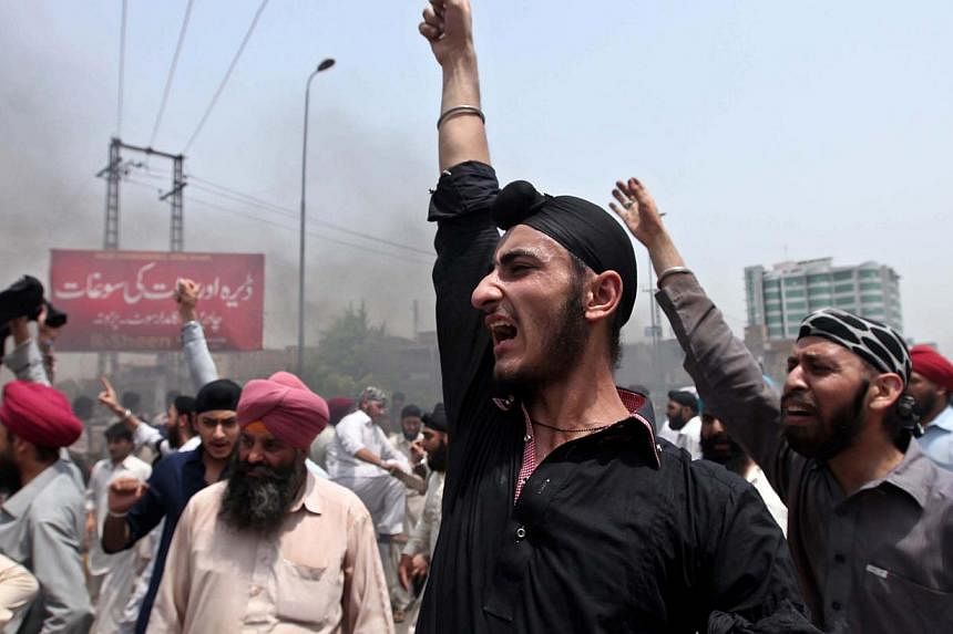 Pakistani minority Sikhs protest against the killing of a colleague on a street in Peshawar on Aug 6, 2014. Members of Pakistan's Sikh community say they have been singled out and attacked increasingly in the South Asian nation where radical Islamist