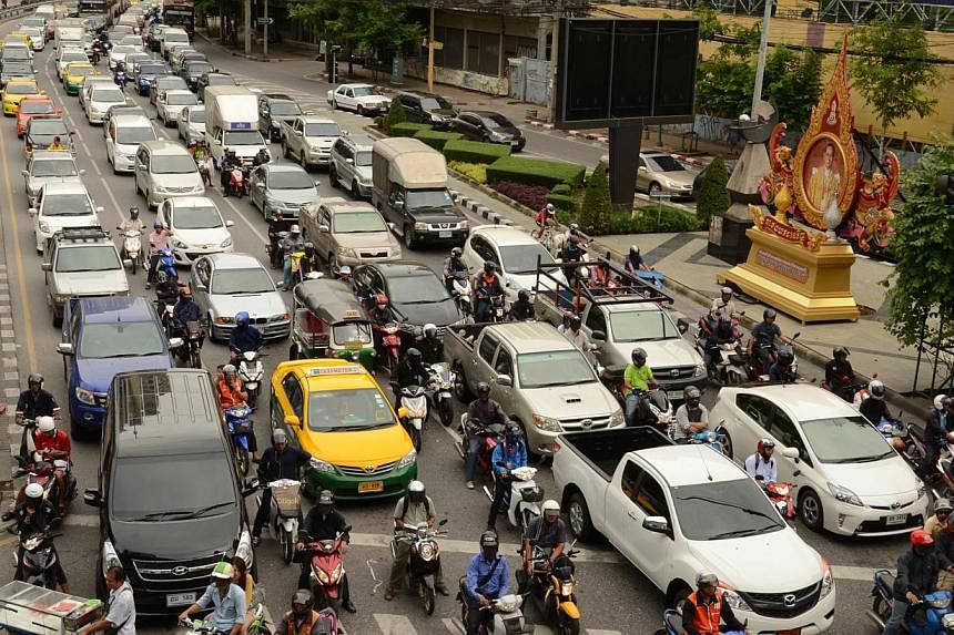 Traffic on Ratchadaphisek Road, a major thoroughfare in Bangkok, Thailand, in a 2013 file photo.&nbsp;Thailand's auto lenders have repossessed three times as many cars as they did a year ago as defaults soar in a flatlining economy. -- ST FILE PHOTO