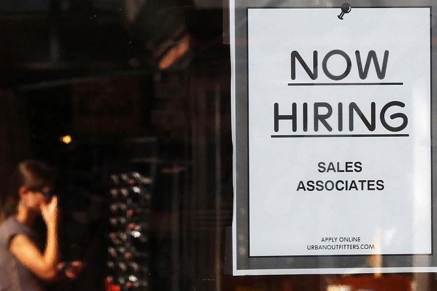 The US jobs machine shifted into a higher gear in September, pushing the unemployment rate down to 5.9 per cent, the lowest level in six years. -- PHOTO: REUTERS