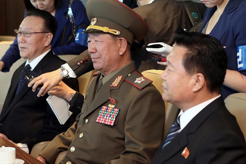 Mr Kim Yang Gon (left), head of the United Front Department of the ruling Workers' Party of North Korea who is in charge of relations with the South, Mr Hwang Pyong So (centre), director of the military's General Political Bureau, the top military po