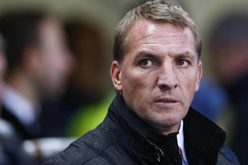 Liverpool manager Brendan Rodgers has warned supporters it will take time to revive his squad and that they may have to endure more "pain" before things get better. -- PHOTO: REUTERS