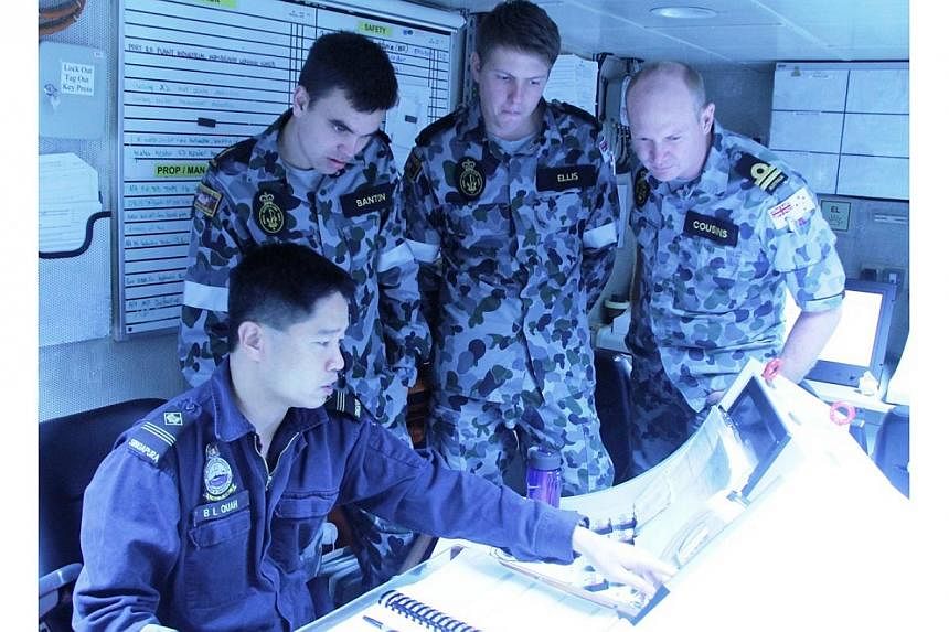 Personnel from the Singapore and Australian navies interacting during the exercise. -- PHOTO: MINDEF