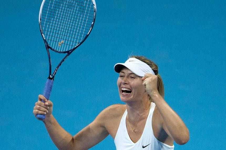 Maria Sharapova of Russia reacts after winning against Petra Kvitova of the Czech Republic during their women's singles final match at the China Open tennis tournament in the National Tennis Centre of Beijing on Oct 5, 2014, her first tennis title si