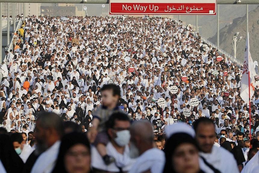 Muslim pilgrims arrive to cast stones at pillars symbolising Satan, during the annual haj pilgrimage, on the first day of Eid al-Adha in Mina, near the holy city of Mecca, Oct 4, 2014.&nbsp;&nbsp;Saudi Arabia has mounted a battle for hearts and minds