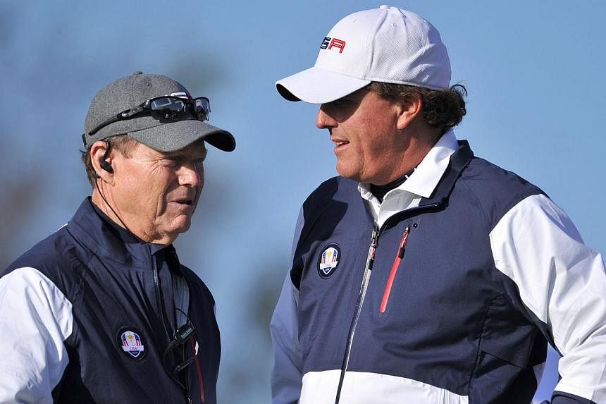 Phil Mickelson of Team US (right) speaks with US team captain Tom Watson during the first day of the Ryder Cup golf tournament at Gleneagles, Scotland, on Sept 26, 2014. Remarks by Mickelson against Tom Watson after a loss at Gleneagles came after th