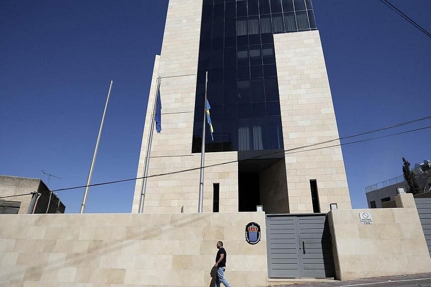 A Palestinian man walks outside the Consulate General of Sweden in Jerusalem, on Oct 5, 2014.&nbsp;The Israeli foreign ministry on Monday summoned Sweden's ambassador to protest over Stockholm's declared intention to recognise a Palestinian state. --