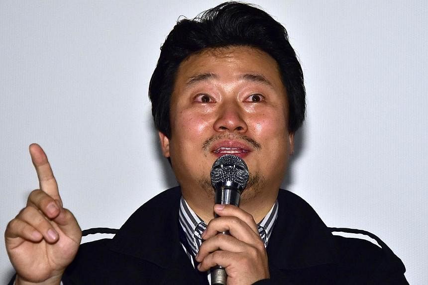 South Korean director Lee Sang Ho speaks at a guest visit event after a screening of his film Diving Bell, The Truth Shall Not Sink with Sewol, during the 19th Busan International Film Festival (BIFF) on Oct 6, 2014. The&nbsp;controversial film premi
