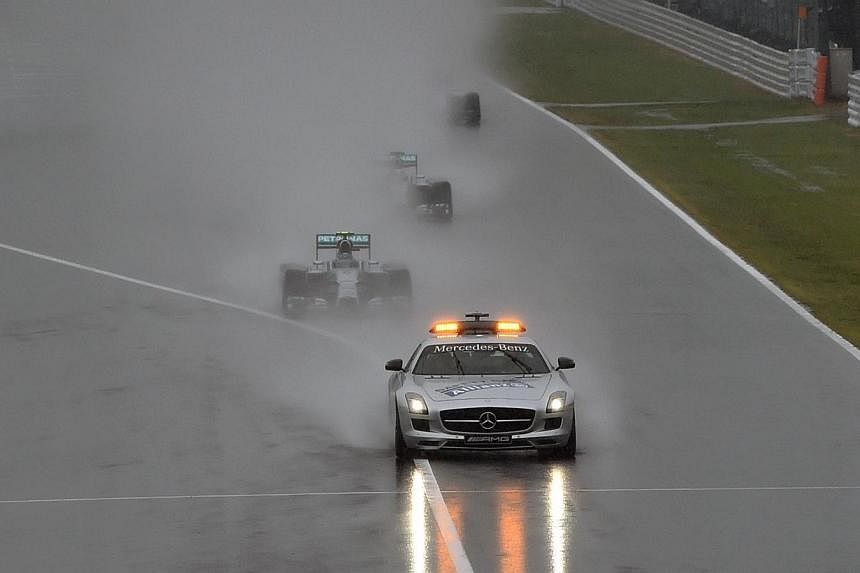 A safety car drives in front as the race was stopped due to heavy rain at the Formula One Japanese Grand Prix in Suzuka on Oct 5, 2014.&nbsp;Formula One must change its Safety Car protocol and make their deployment automatic with every crash, 2007 wo