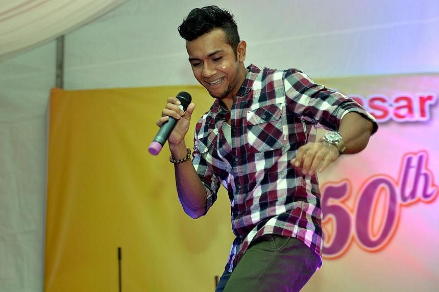Taufik Batisah performing at Geylang Serai's 50th anniversary celebrations on April 25, 2014. -- BH PHOTO: M.O. SALLEH