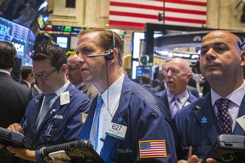 Traders work on the floor of the New York Stock Exchange October 2, 2014. -- PHOTO: REUTERS&nbsp;