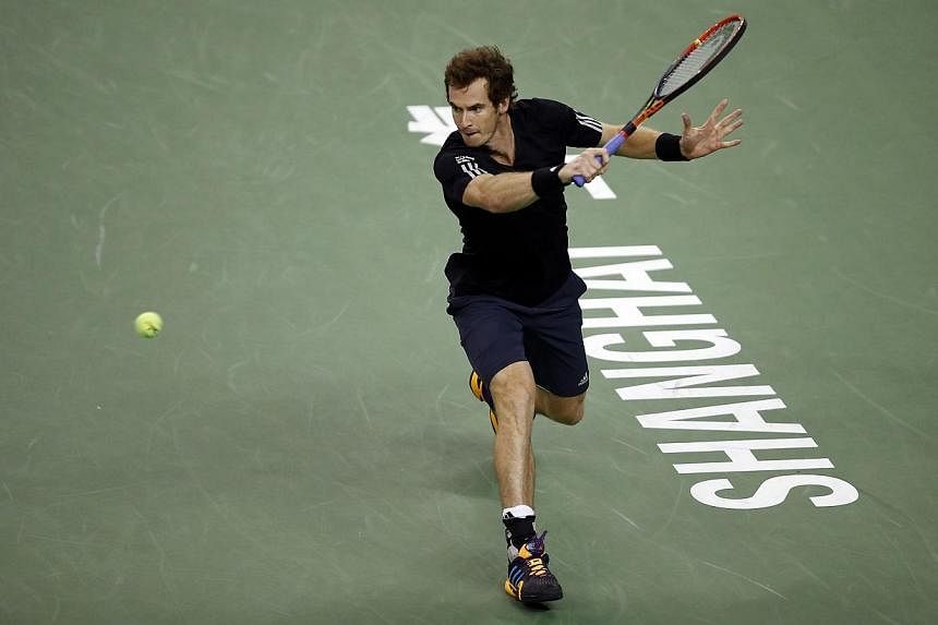 Andy Murray of Britain returns a shot during his men's singles tennis match against Teymuraz Gabashvili of Russia at the Shanghai Masters tennis tournament in Shanghai on Oct 7, 2014. Murray's bid to make the end of season ATP World Tour Finals remai
