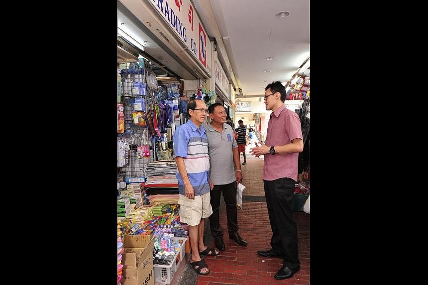 Mr Tan Yian Leong (left), who owns Nam Loo Guan Trading Company in Marine Parade Central, with MPMA honorary secretary Victor Thya and Mr Dominic Lim (right), head of WeCare@Marine Parade.
