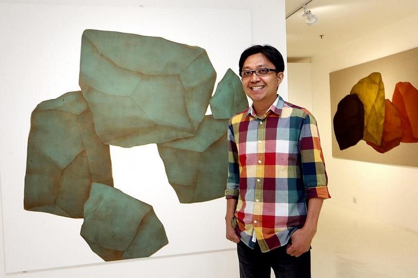Artist Tay Bak Chiang with his painting, Azure Dragon. -- ST PHOTO: CHEW SENG KIM