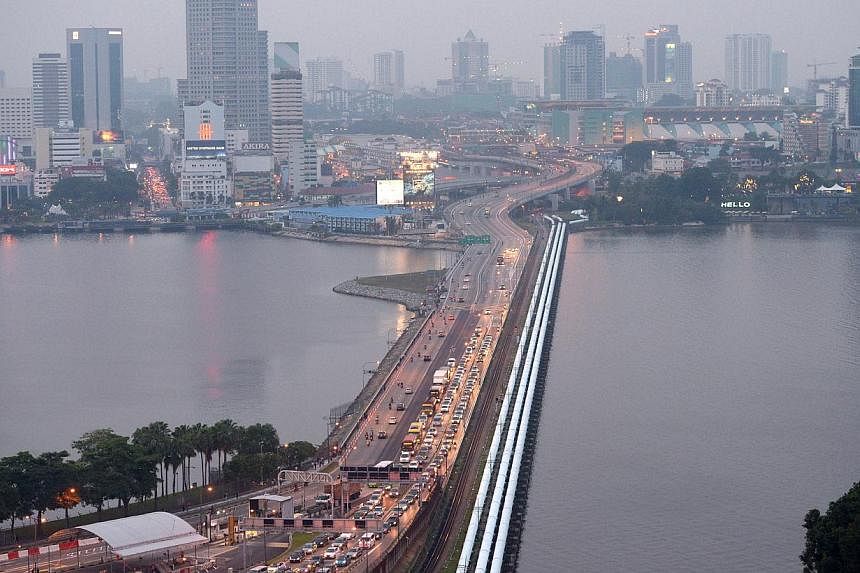 The impact of the Causeway toll hikes on economic activity in Singapore is likely to be small, as land transport takes up a small portion of business costs, Minister of State (Trade and Industry) Teo Ser Luck said on Tuesday. -- PHOTO: ST FILE