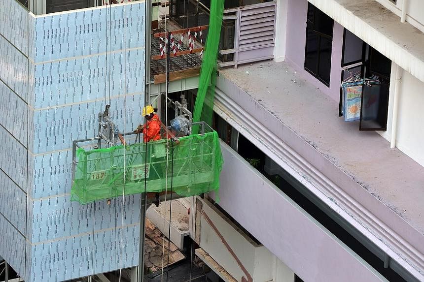 A construction worker is seen at the Lift Upgrading Programme (LUP) in the Henderson Crescent estate.&nbsp;The Government will spend nearly $100 million in a new programme to replace ageing lifts, National Development Minister Khaw Boon Wan announced