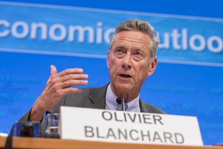 This IMF photo shows International Monetary Fund Economic Counsellor and Director of the Research Department Olivier Blanchard as he speaks on a panel to discuss World Economic Outlook at the first press briefing of the 2014 IMF/World Bank Annual Mee
