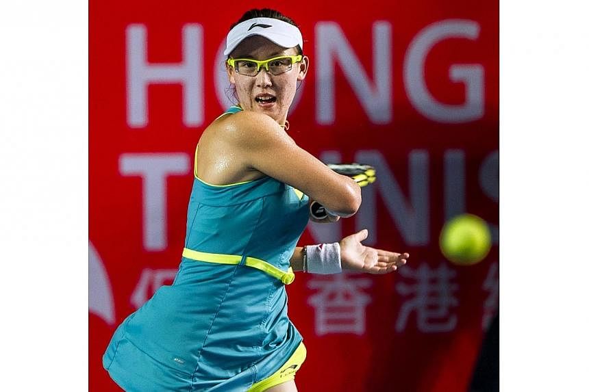 China's Zheng Saisai returns the ball to Germany's Sabine Lisicki during their women's quarter final singles tennis match at the Hong Kong Open on Sept 12, 2014. -- PHOTO: AFP