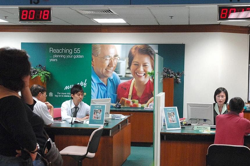 CPF members queueing at CPF Inquiry Counters at the CPF Building.&nbsp;-- PHOTO: ST FILE