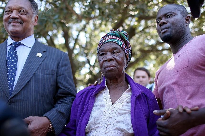 Rev. Jesse Jackson (L) stands with Nowai korkoyah (C) the mother of Ebola patient Thomas Eric Duncan, as well as his nephew, Josephus Weeks, after they spoke to the media at the Texas Health Presbyterian hospital on October 7, 2014 in Dallas, Texas. 