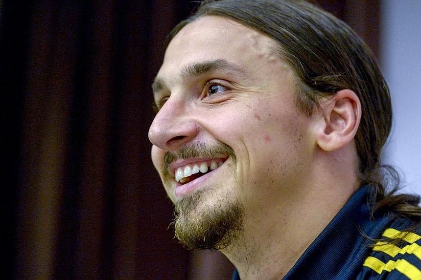 Sweden soccer captain Zlatan Ibrahimovic smiles during a news conference at the Scandic Park Hotel in Stockholm on Oct 7, 2014. -- PHOTO: REUTERS