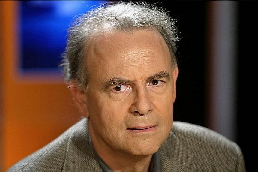 A photo taken on Oct 7, 2003 in Paris shows French writer Patrick Modiano who won the 2014 Nobel Prize in Literature, the Royal Swedish Academy announced on Oct 9, 2014 in Stockholm, Sweden. Mr Modiano's work has often focused on World War II and the