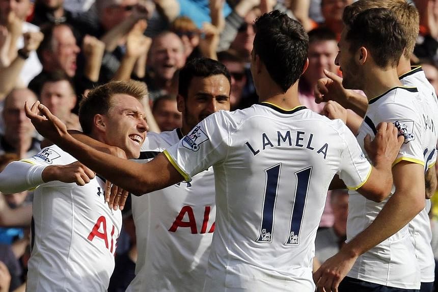 Tottenham Hotspur's Christian Eriksen (left) celebrates after scoring the opening goal during their English Premier League soccer match against Southampton at White Hart Lane in London, England on Oct 5, 2014.&nbsp;Uefa general secretary Gianni Infan