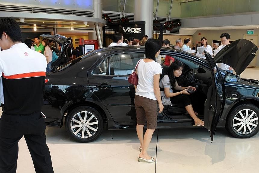Potential buyers at a Totoya car showroom. -- PHOTO: ST FILE