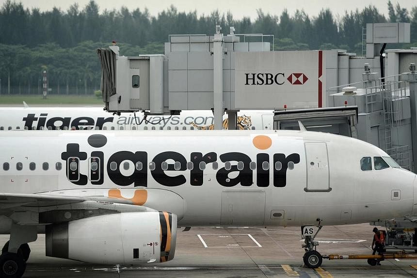 Tiger Airways Holdings will sublease 12 of its aircraft to Indian budget carrier InterGlobe Aviation in a move to reduce excess capacity and cut costs. -- PHOTO: ST FILE