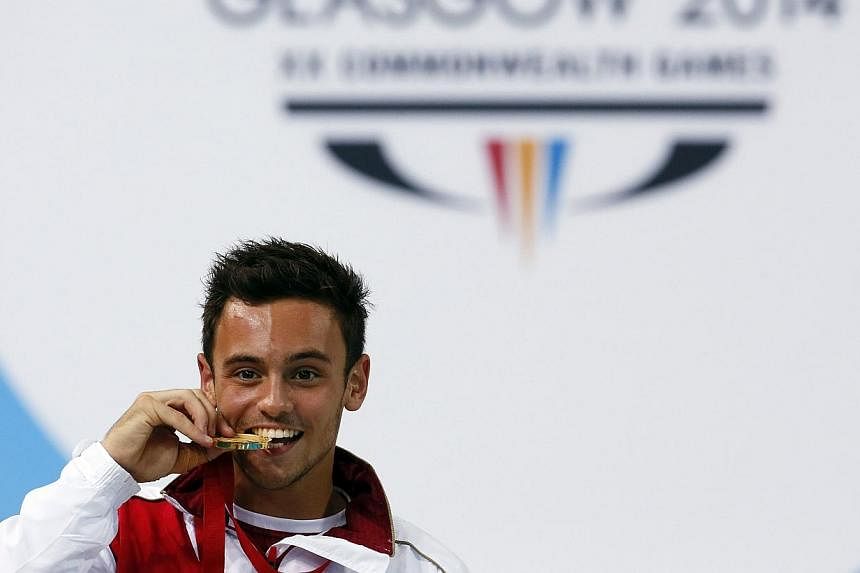 Tom Daley of England poses with his gold medal after winning the men's 10m Platform final at the 2014 Commonwealth Games in Edinburgh, Scotland, on Aug 2, 2014. -- PHOTO: REUTERS